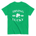 Green t-shirt with an illustration of a shamrock with the caption "Trying to get lucky".