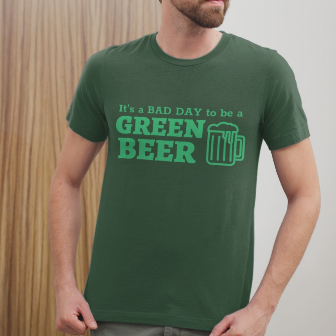 Video of a male model wearing a green t-shirt with an illustration of a green beer mug with the caption "It's a bad day to be a green beer".			
